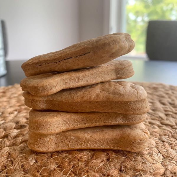 True Nature Peanut Butter Dog Treats stacked.